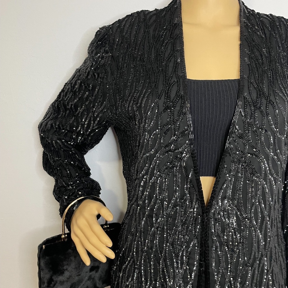 Vintage 60’s duster sequin sweater with a clip below the bust super chic elegant